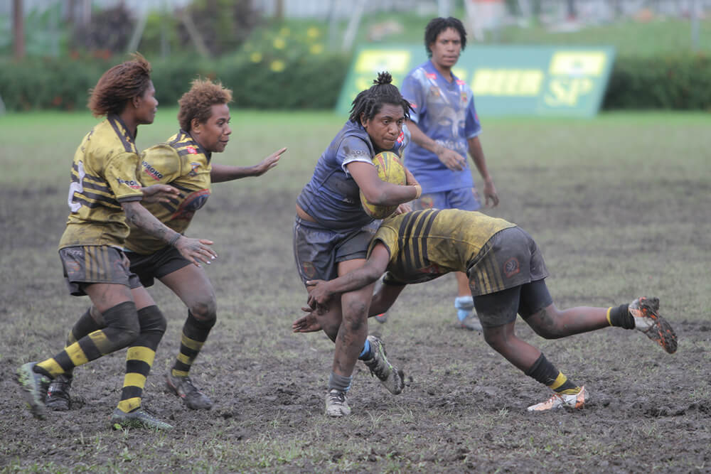 Female rugby players in action 