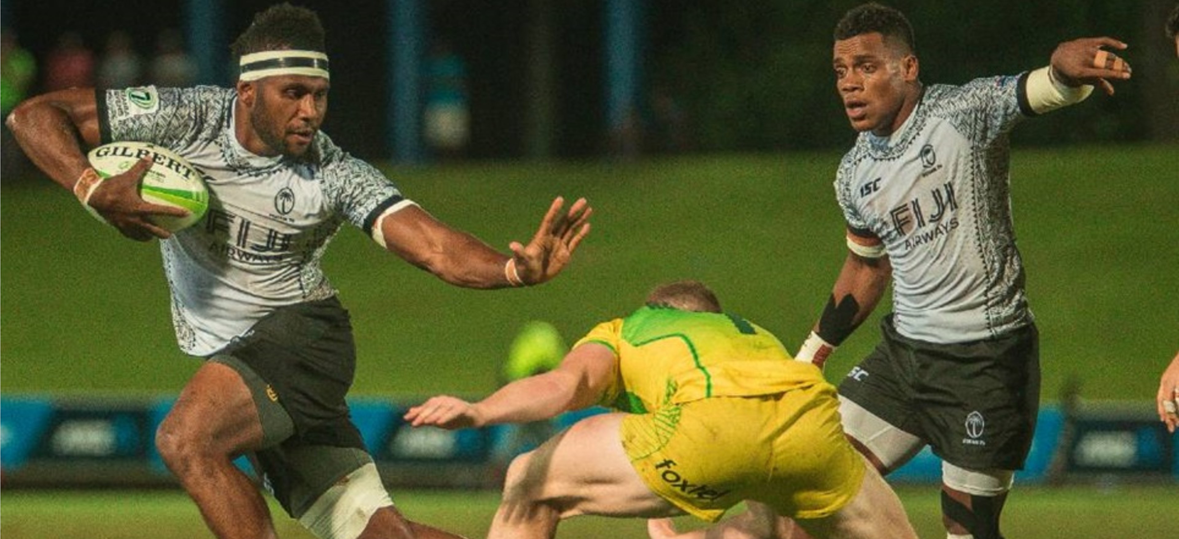 Fijian player tackled by Australian player