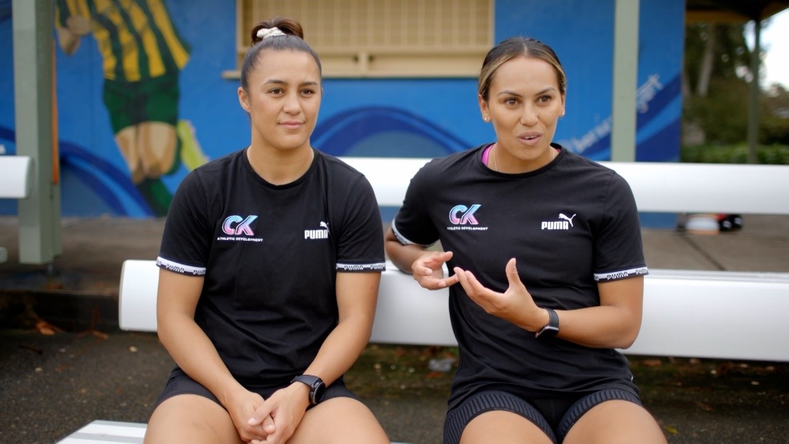 Two women rugby league players being interviewed.