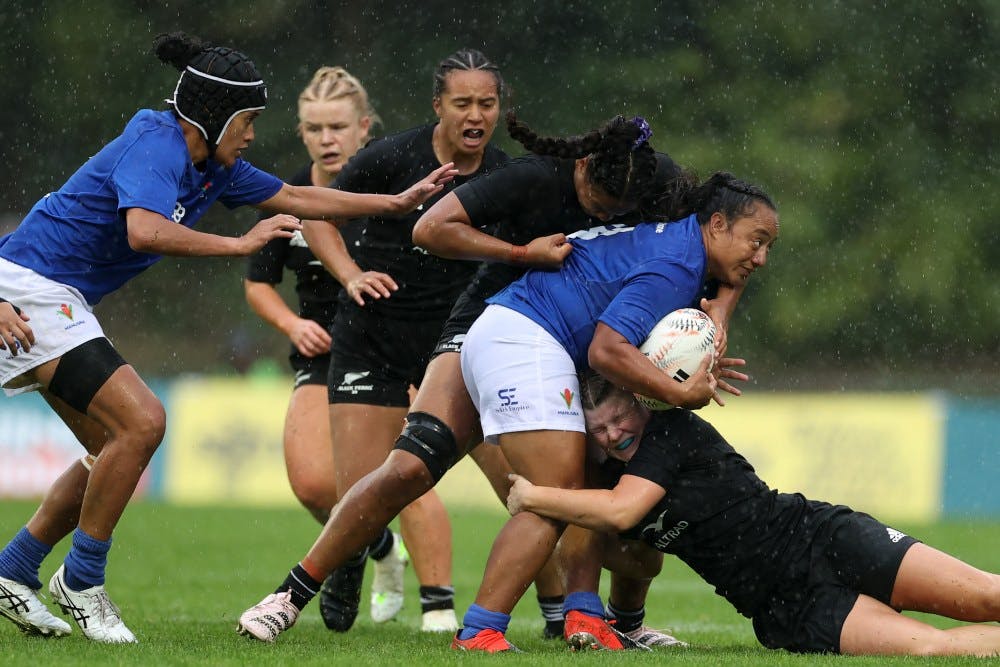 female rugby union players in action
