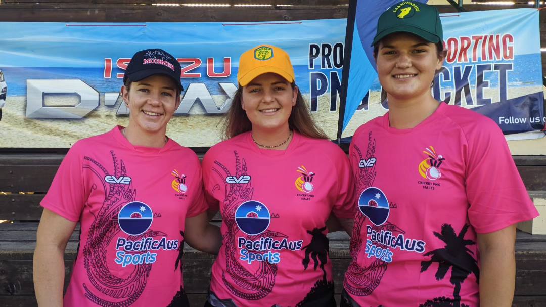 three athletes smiling