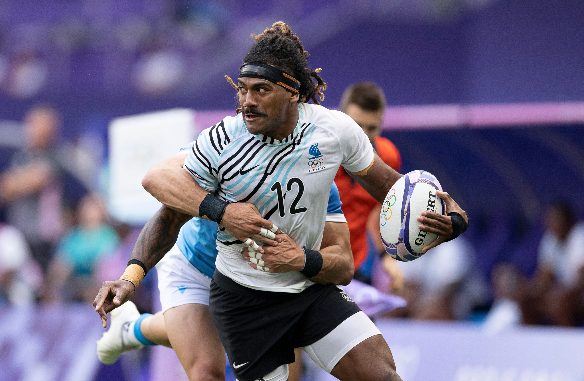 Fijian rugby player mid-game