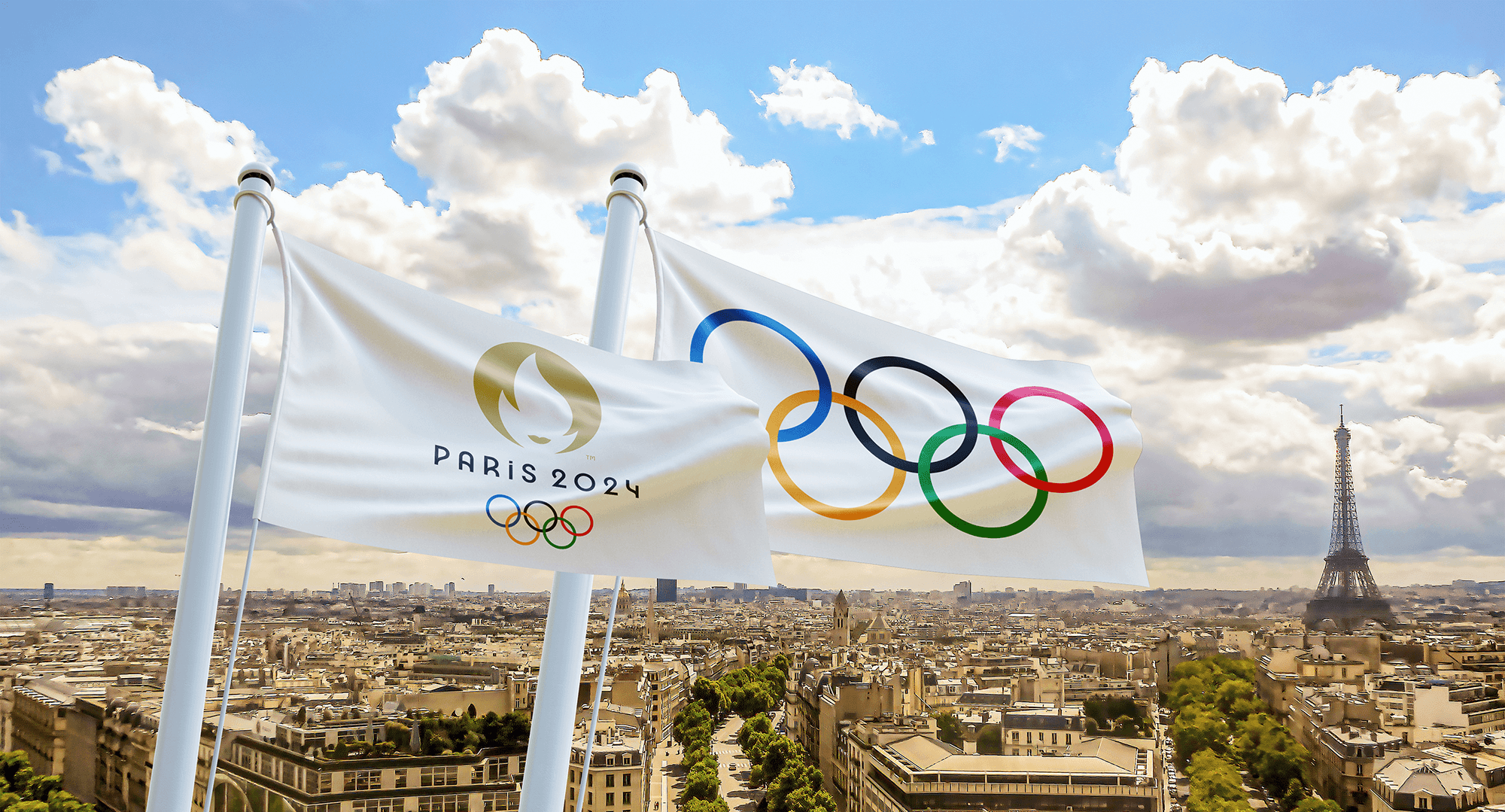 two flags baring the Olympic Games logo, the Eiffel tower in the background