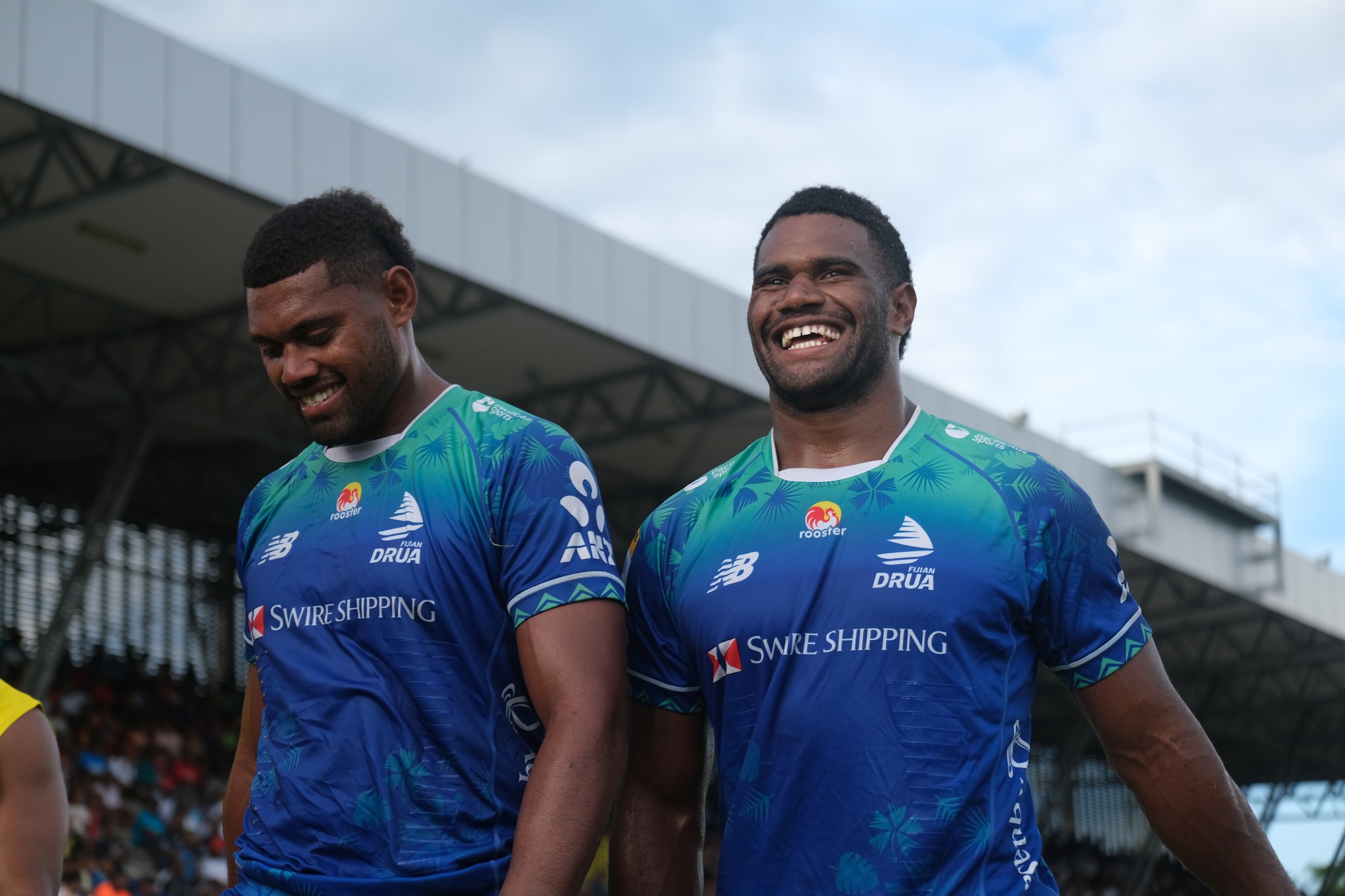 two Fijian rugby players smiling
